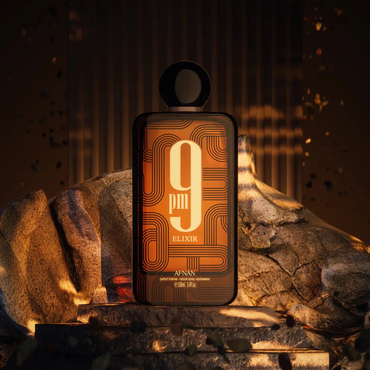 Afnan 9pm Elixir perfume bottle on a stone surface with warm lighting